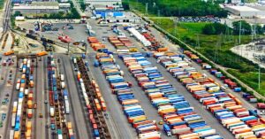 Birds eye view of yard tractors and lorries in regional distribution centre